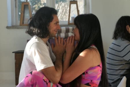 Couple practicing yoga together during a couples retreat in Sweden, deepening love and connection